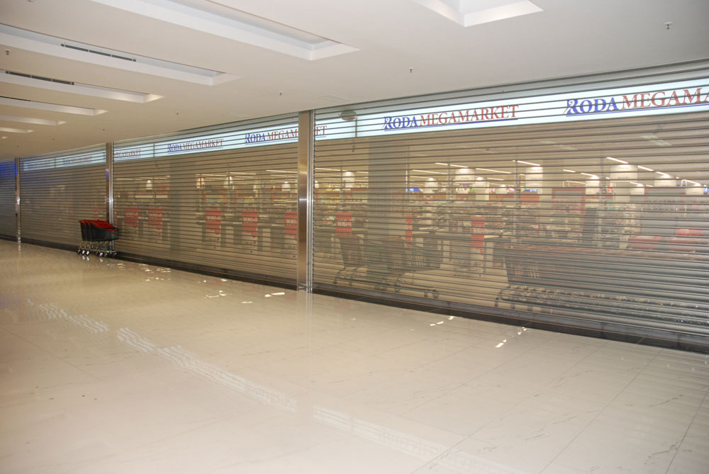 Perforated roller shutters for stores